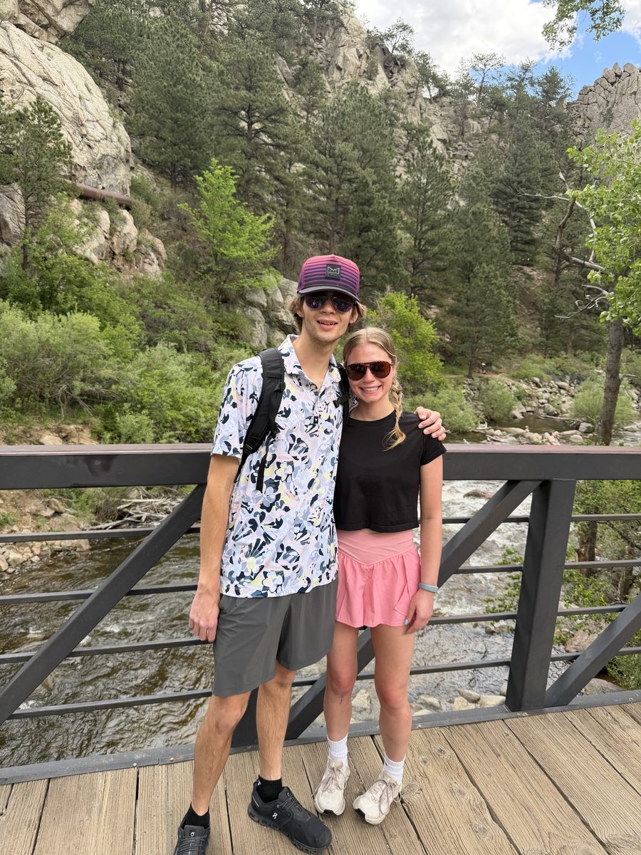 Gage and Grace on a bridge over a river in the Colorado mountains
